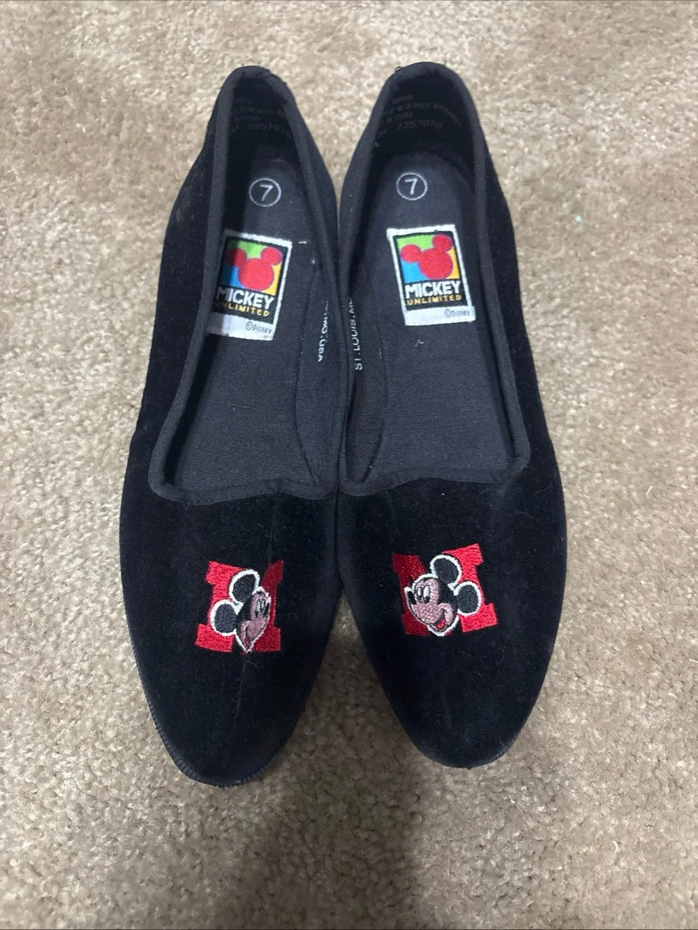 Mickey Unlimited black velvet slip-on flats featuring an embroidered Mickey Mous